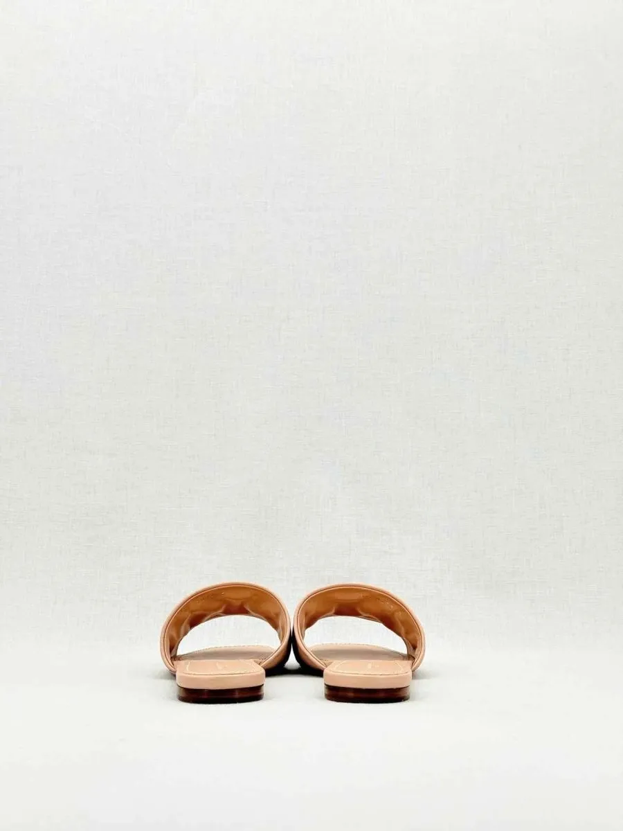 LOUIS VUITTON Revival Beige Monogram Embossed Mules 38